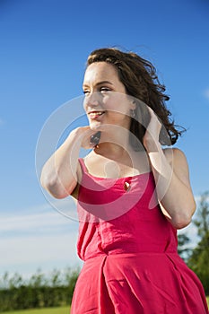 Young lady on a blue sky background