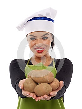 Young lady cook offering potatoes