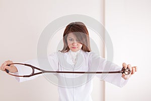 Young lady doctor showing her stethoscope