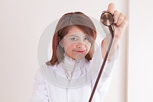 Young lady doctor showing her stethoscope
