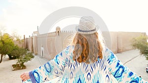 Young lady in ethnic dress in Khiva, Uzbekistan