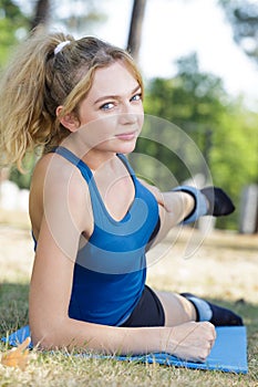 young lady exercising with weights on ankles