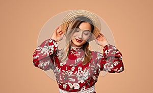 Young lady in floral dress looking down