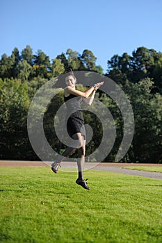 Young lady flying over lawn