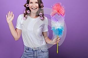 A young lady is having fun while cleaning