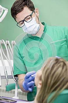 Young lady having her teeth examined