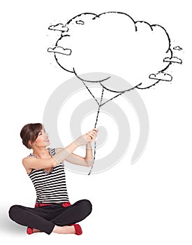 Young lady holding cloud balloon drawing