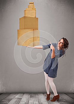 Young lady holding a set of brown cardboard boxes