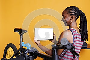 Young lady holds tablet with whitescreen