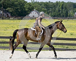 Young lady horseback riding