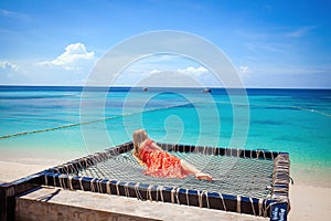 Young lady indulging in a peaceful moment on a hammock