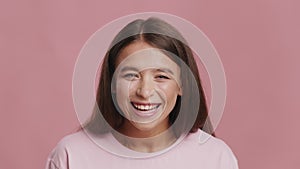 Young Lady Laughing Out Loud Looking At Camera, Pink Background