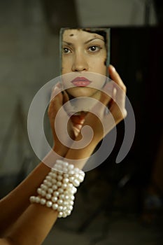 Young lady with mirror