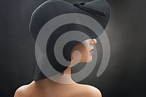 Young lady in a nice black hat.