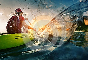 Young lady paddling hard