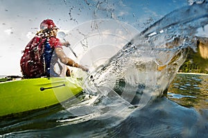 Young lady paddling hard