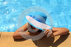 Young lady by the poolside