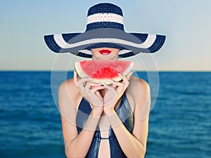 Young lady at sea with watermelon