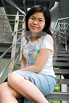 Young lady sitting at stair