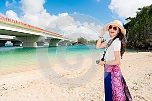 Woman enjoy in Naminoue Beach, Japan.