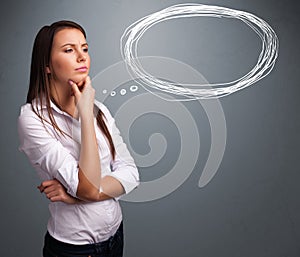 Young lady thinking about speech or thought bubble with copy spa