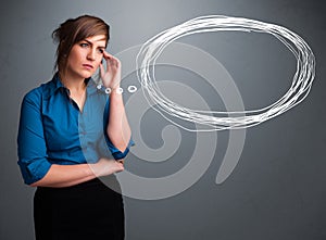 Young lady thinking about speech or thought bubble with copy spa