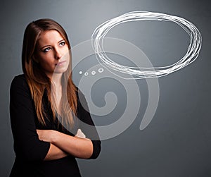 Young lady thinking about speech or thought bubble with copy spa