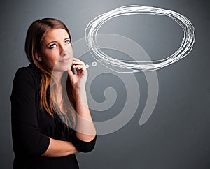 Young lady thinking about speech or thought bubble with copy spa