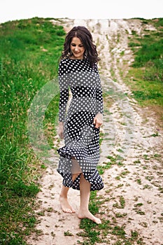 Young lady walking on hill