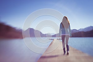 Young Lady Walking on Small Wooden Space Path