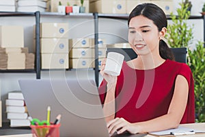 Young lady working at home office