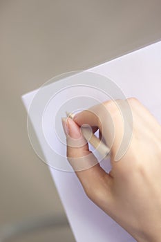 Young lady writing on paper