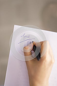 Young lady writing on paper