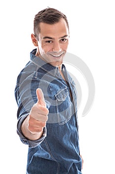Young laid back man giving thumbs up to camera in