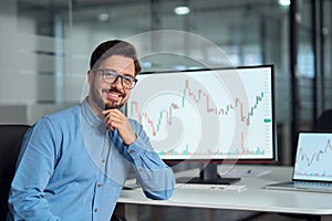 Young latin business man trader crypto investor looking at camera, portrait.