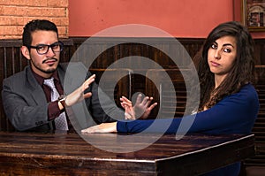 Young latin couple in a restaurant