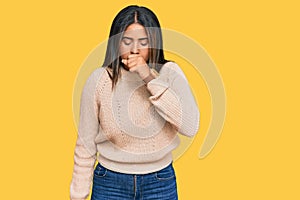 Young latin girl wearing wool winter sweater feeling unwell and coughing as symptom for cold or bronchitis