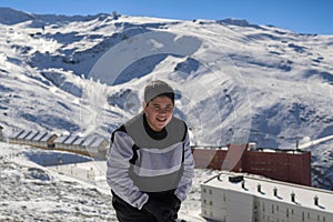 young latin guy with cold,playing in the snow,ski resort sierra nevada,granada,granada,spain