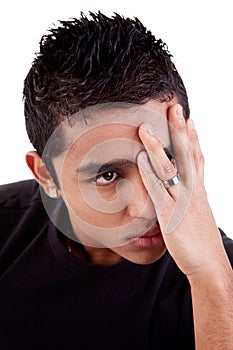 Young latin man, pensive, with his hand on front