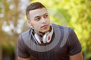 Young latin man runner looking thinking running jogging sports training fitness workout copyspace copy space