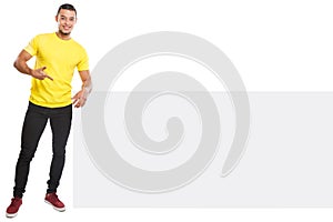 Young latin man showing pointing copyspace marketing ad advert empty blank sign isolated on white