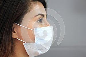 Young latin woman with multilayer face masks for clinical use to prevent covid