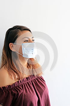 Young latin woman with multilayer face masks for clinical use to prevent covid