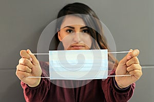 Young latin woman with multilayer face masks for clinical use to prevent covid photo