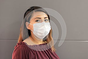 Young latin woman with multilayer face masks for clinical use to prevent covid photo