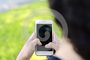 Young latin women sending message with smartphone.