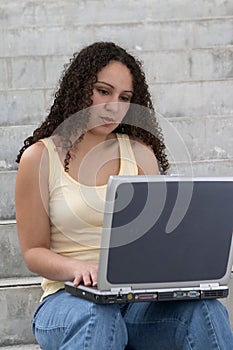 Young Latina Student with Computer