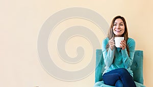 Young latina woman drinking coffee photo