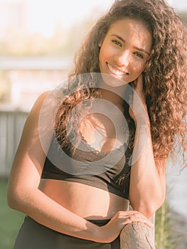 Young Latina woman smiling sweetly