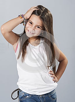 Young latino girl posing in studio